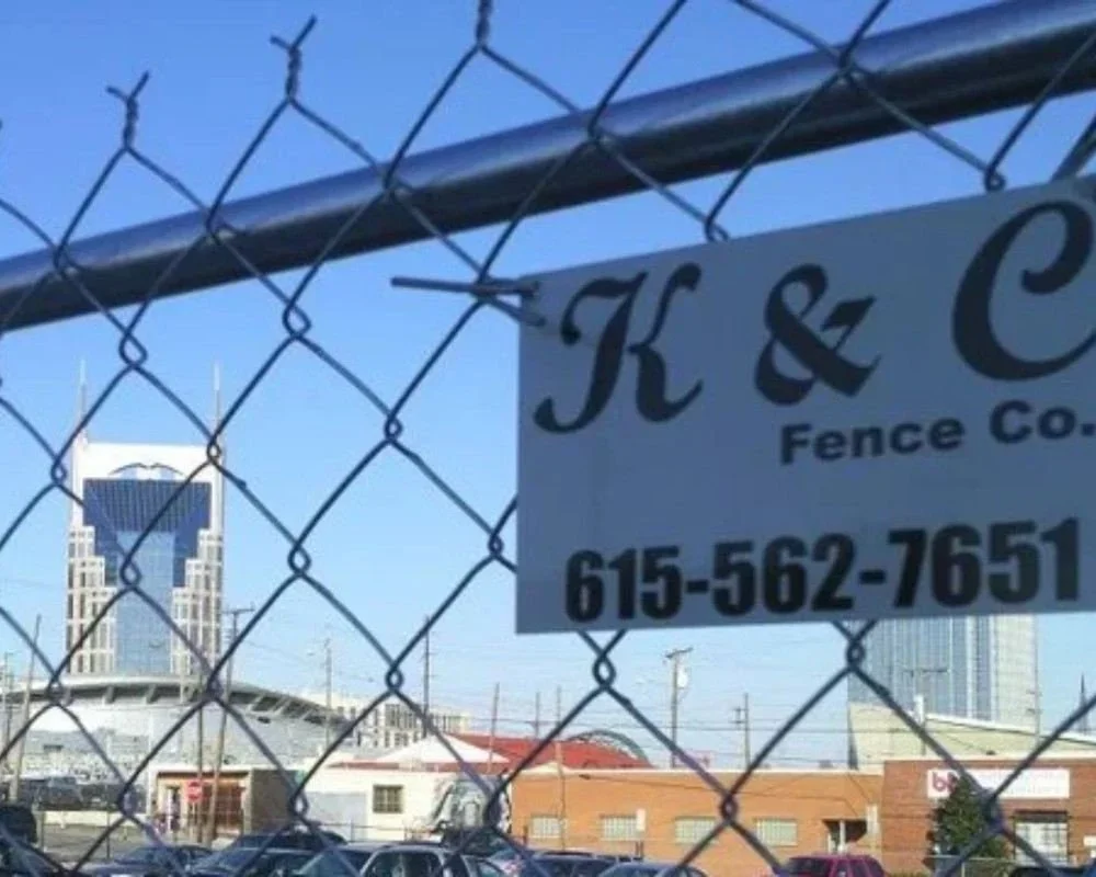 K&C Fence six-foot chain-link fence securing a commercial property in Nashville, Tennessee.