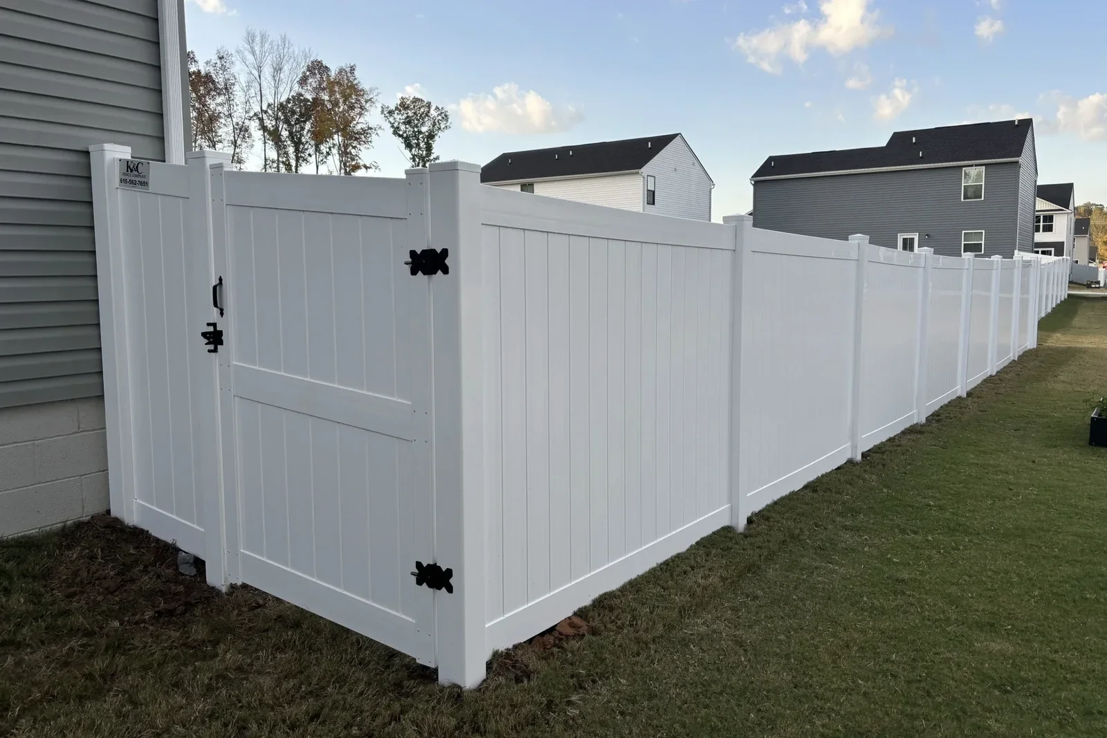K&C Fence installed a white vinyl privacy fence with a double gate in Spring Hill, Tennessee.