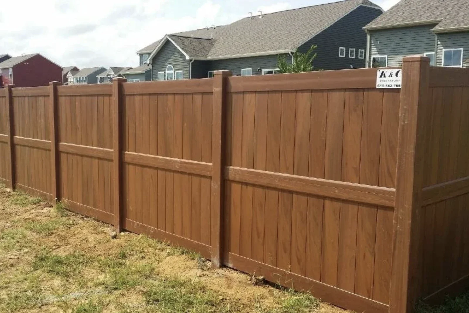 K&C Fence installed a mocha vinyl privacy fence around a residential backyard in Nashville, Tennessee.