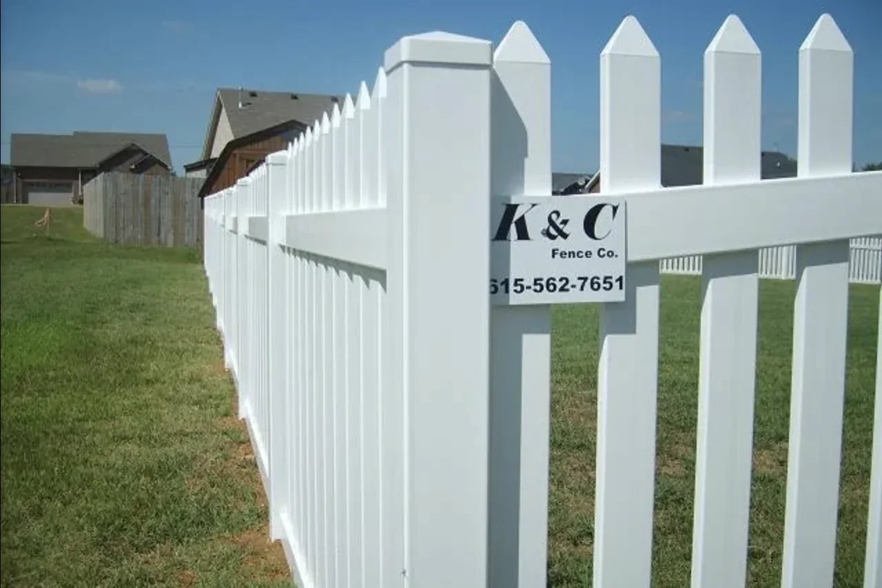 K&C Fence installed a white PVC vinyl picket fence around a grassy yard in Nashville, Tennessee.