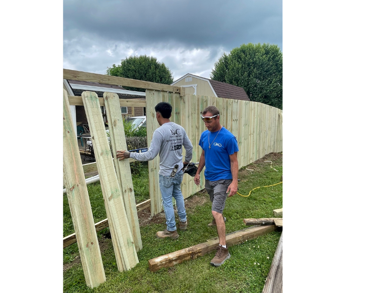 K&C Fence crew installing a wood privacy fence at a residential property in Nashville, Tennessee, showcasing professional fence construction by a local Nashville fence contractor.
