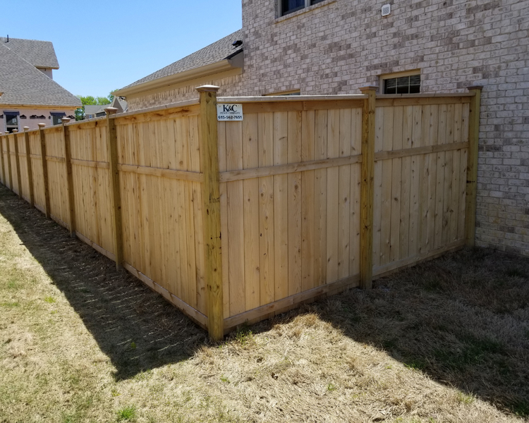 K&C Fence installed a 6‑foot wood privacy fence at a Franklin, TN home, creating a warm cedar backyard enclosure for added privacy and security.