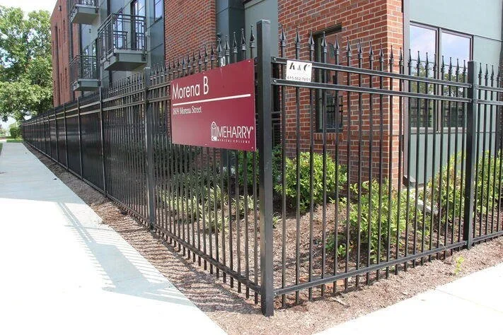 Black ornamental aluminum steel fence installed by K&C Fence providing secure and attractive perimeter fencing for a commercial property in Nashville, Tennessee.