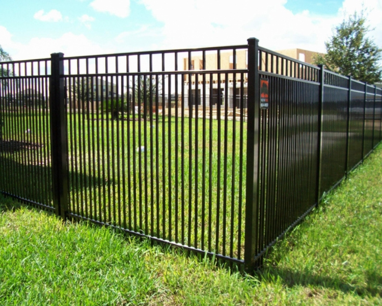 Black commercial aluminum fence with secure gates protecting a business property, installed by K&C Fence in Murfreesboro, TN.