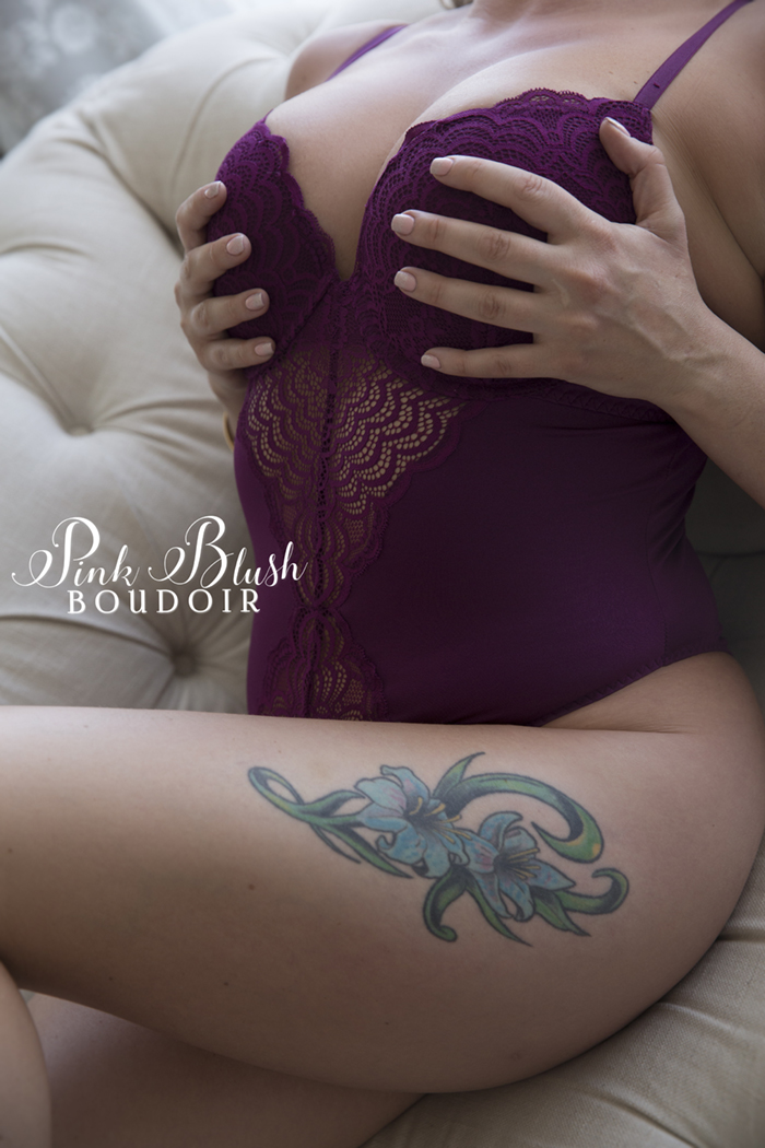 boudoir photography, a woman in a purple bodysuit
