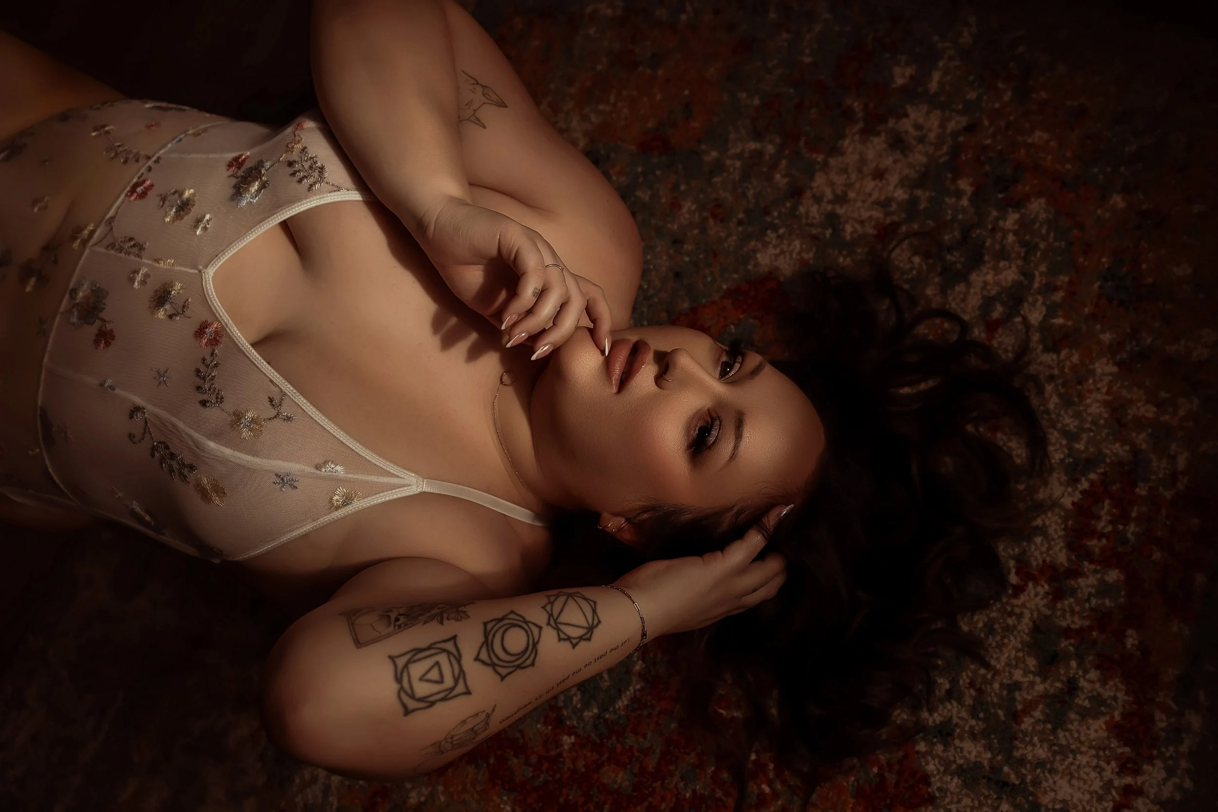 Curvy woman in sheer white lingerie, in pink boho inspired set, Boudoir Photography studio Edmonton Alberta