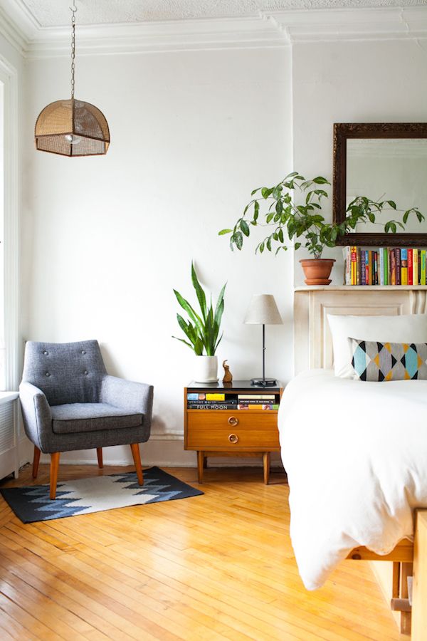 Live plants, warm earthy shades (green, blue, and brown) can liven up a space while still looking effortless. ( source )