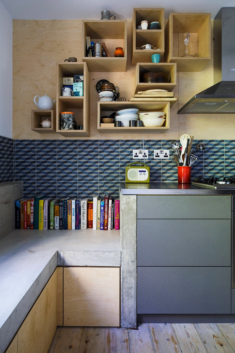 Unique geometries and bright contrasting colors really make this space feel comfortable and friendly. ( source )