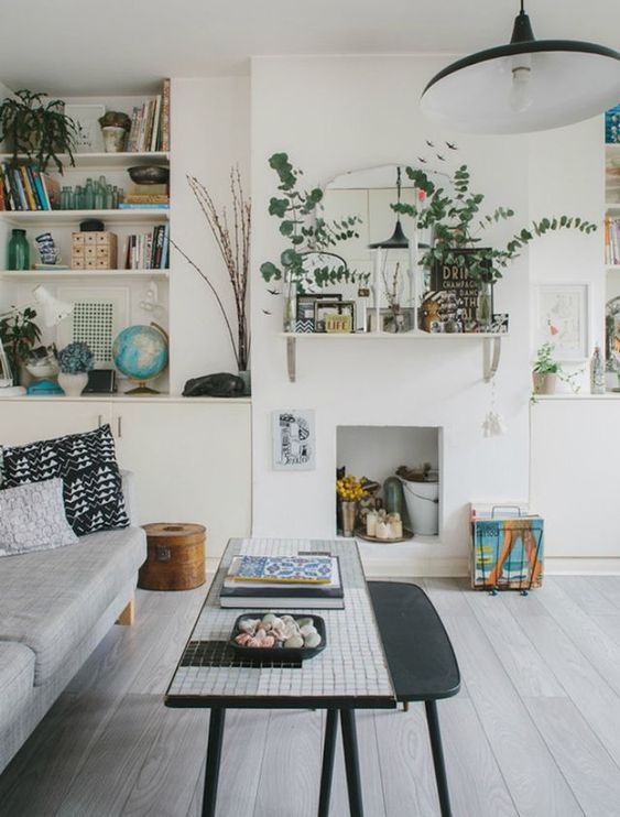 ( . ) We just love the gray flooring with the pops of color. The adaptive reuse of the fireplace is a nice touch, too!