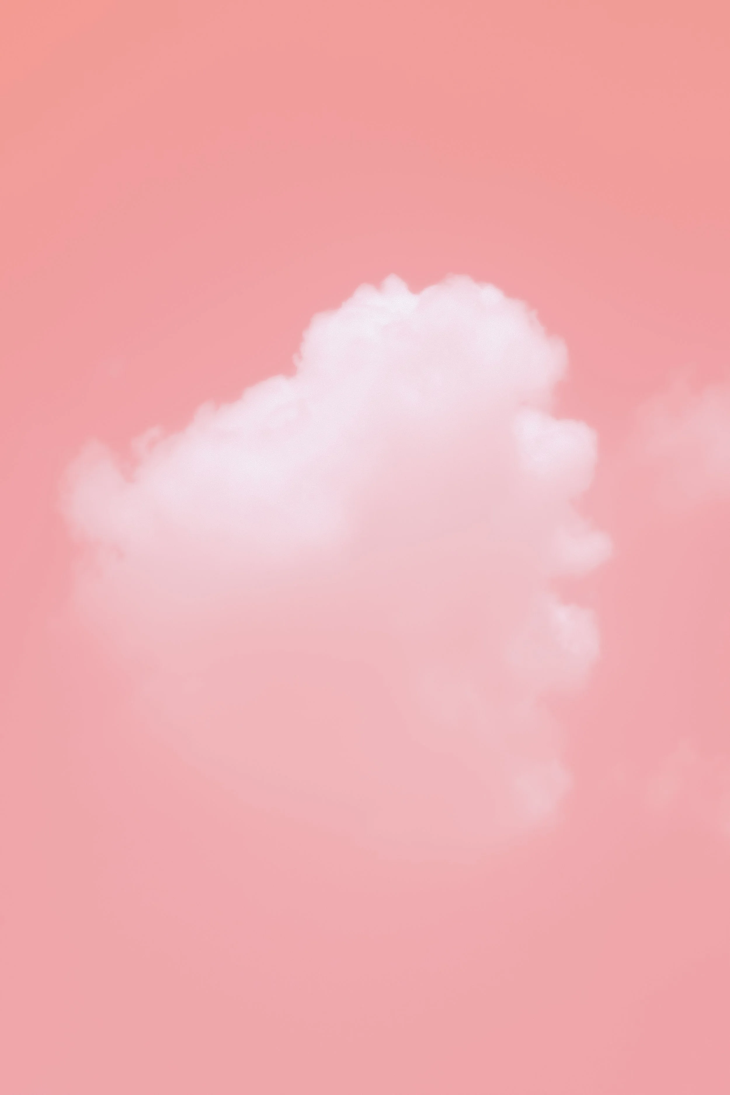 A white cloud against a pink background.