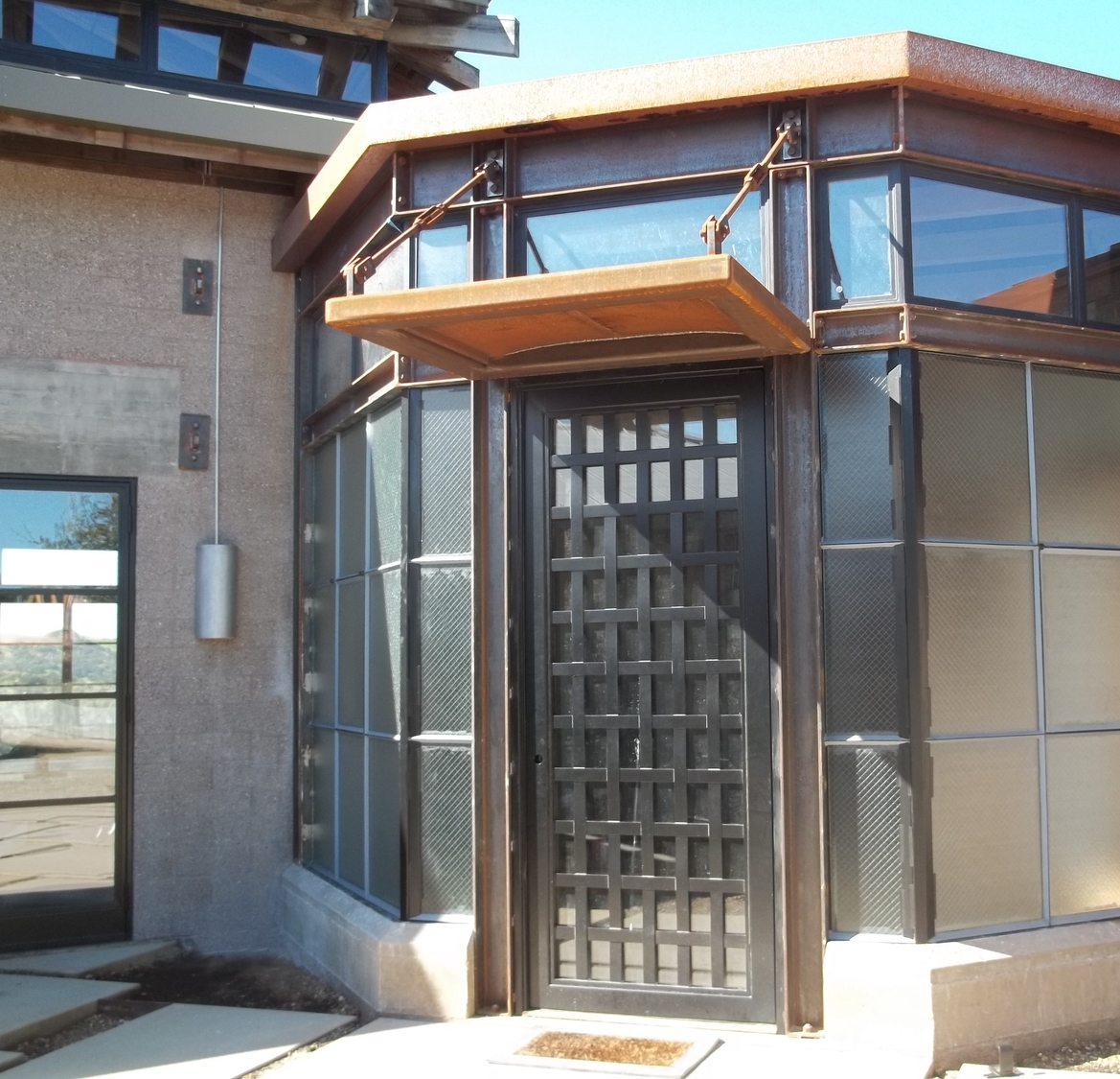 Castlewood Metal Weave Pivot Door