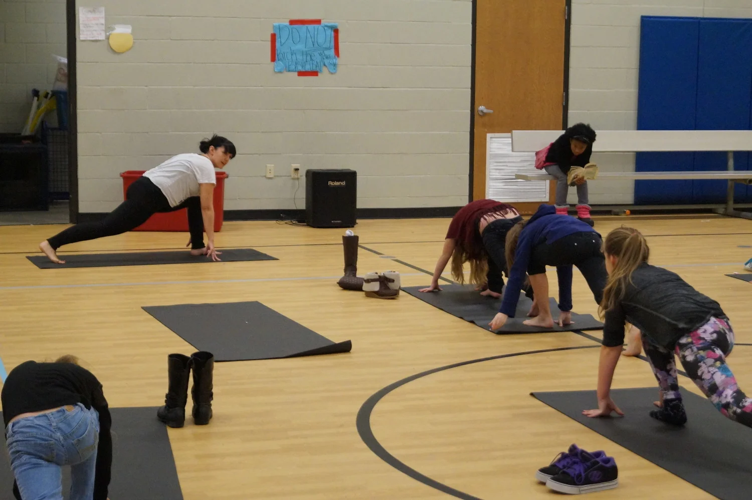 Rachel from Peak teaching Yoga lessons.