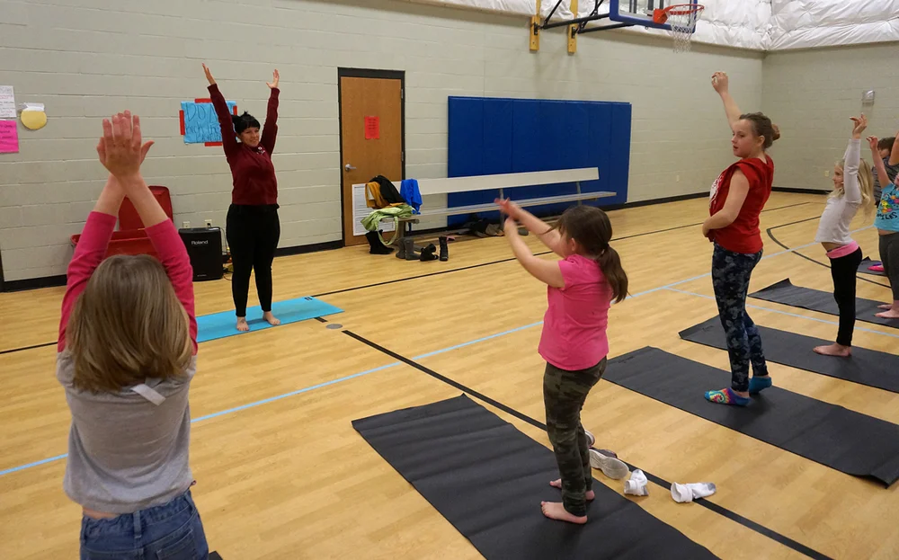 Rachel from Peak teaches a Yoga class.