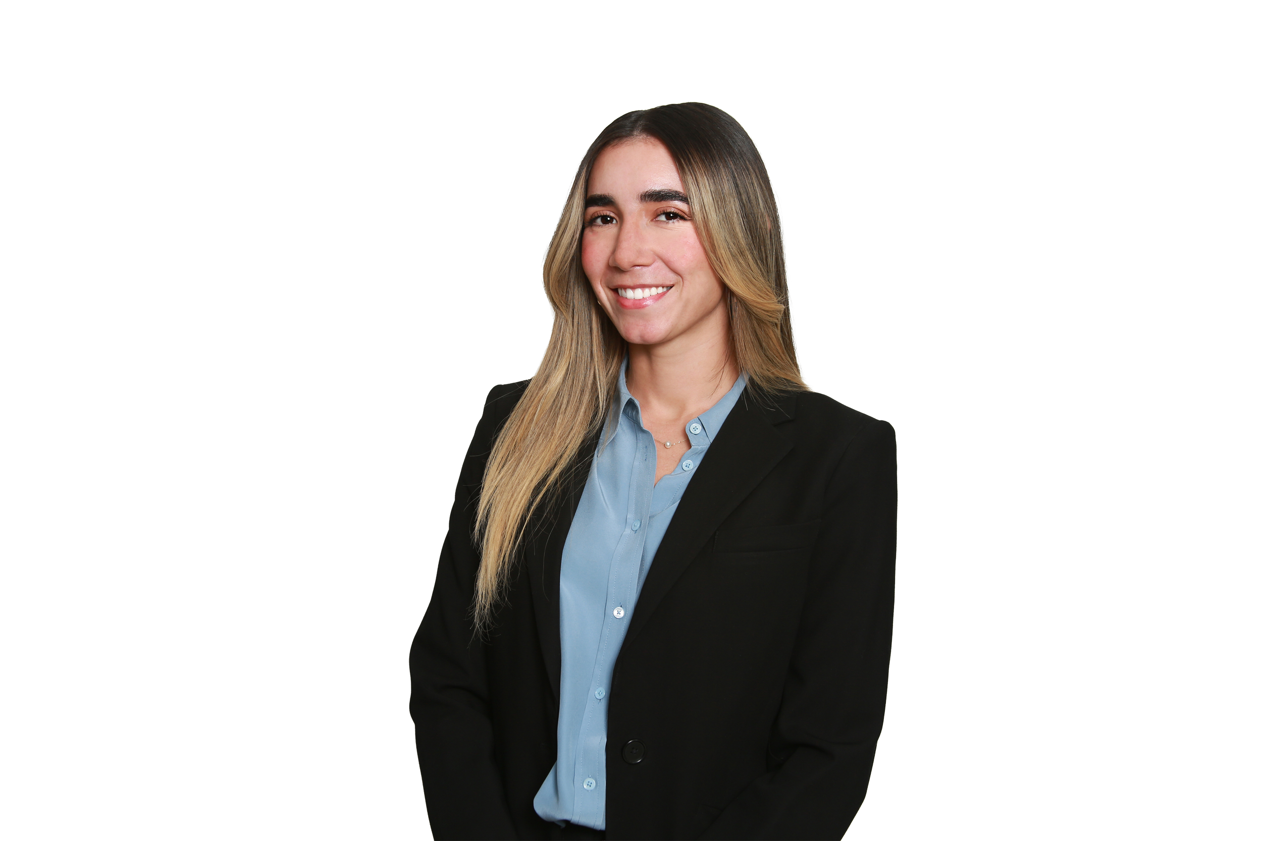 Portrait of a young woman in a business suit smiling, with long blonde hair and a blue shirt.