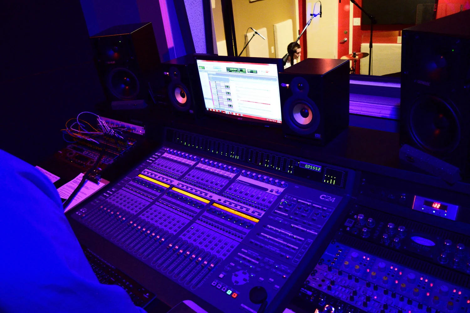 Mixing board and Ethan Rietz recording drums for Echoes In Me