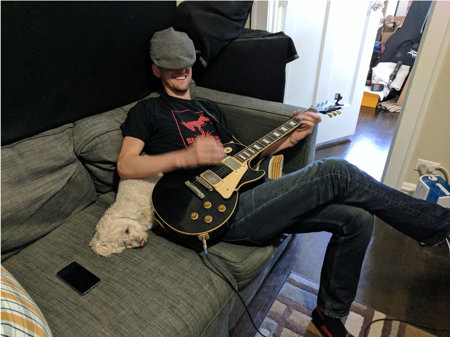 Curtis Weigel recording guitar with dog