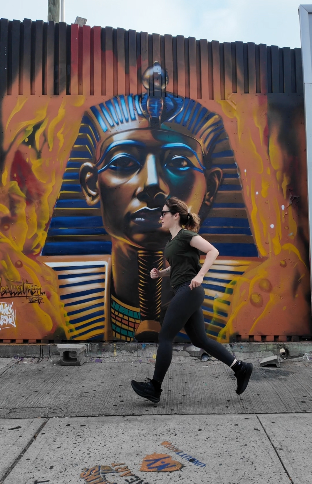find a running coach brooklyn street art runner