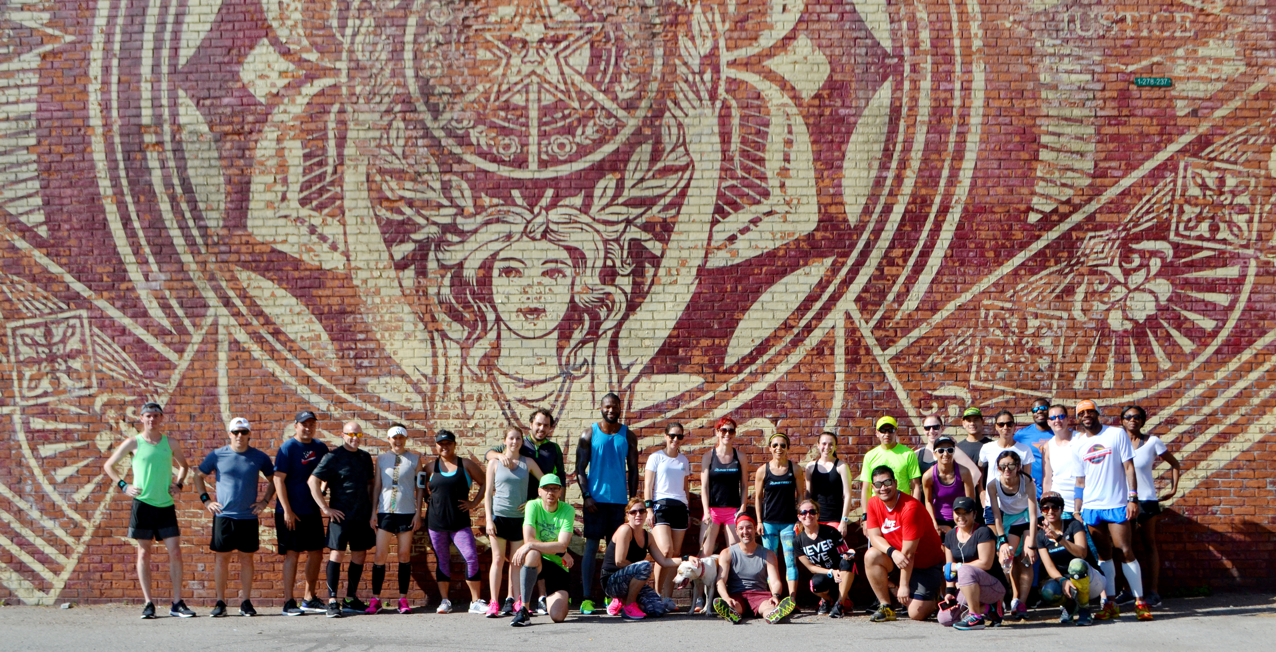 Photo by Filles + Garçons Photography . Mural by Shepard Fairey .