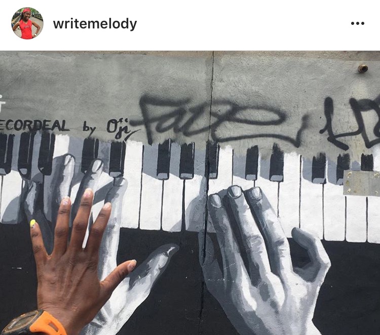 Congrats to our photo contest winner @writemelody on her creative shot at the Bushwick Collective!. Mural by Oji .