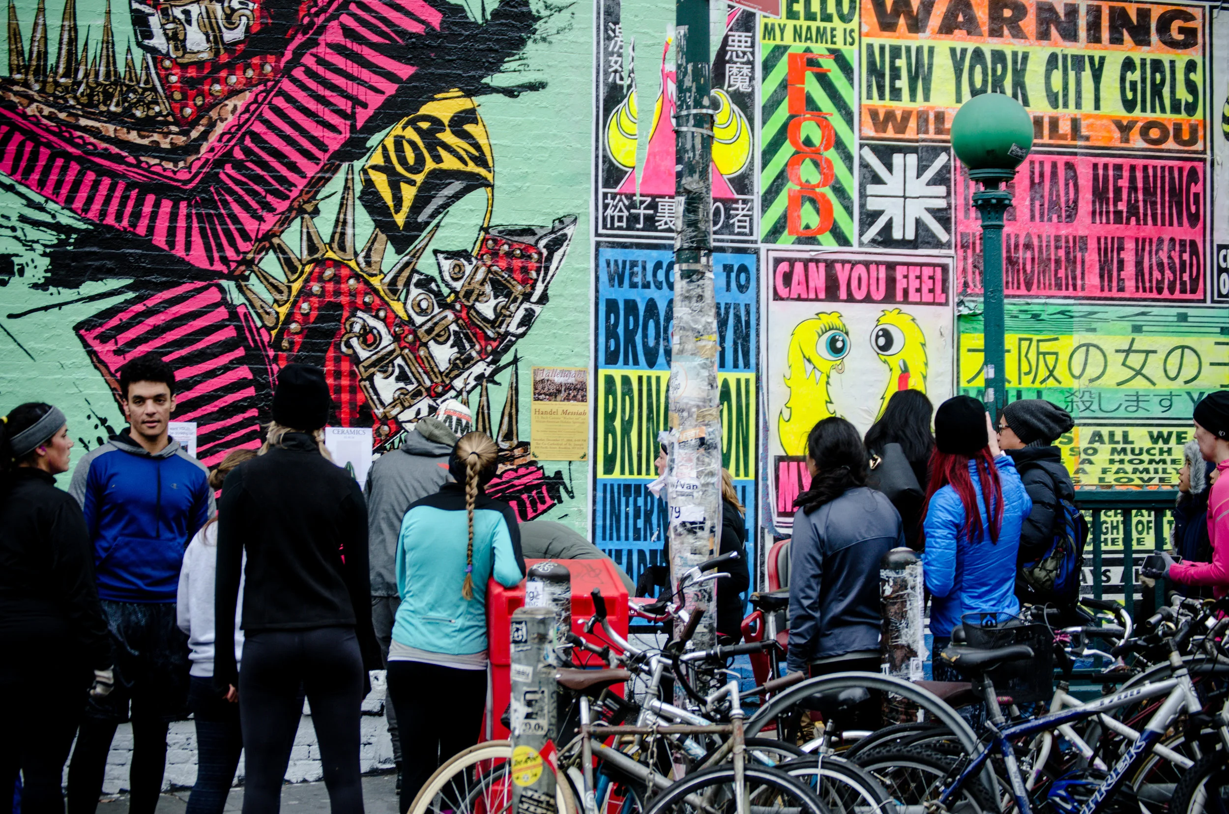 Runstreet Art runners in Williamsburg stop to admire Xors' and Flood Club's epic mural on Bedford Ave off the L stop in Brooklyn. Photo by Filles Garcons Photography.
