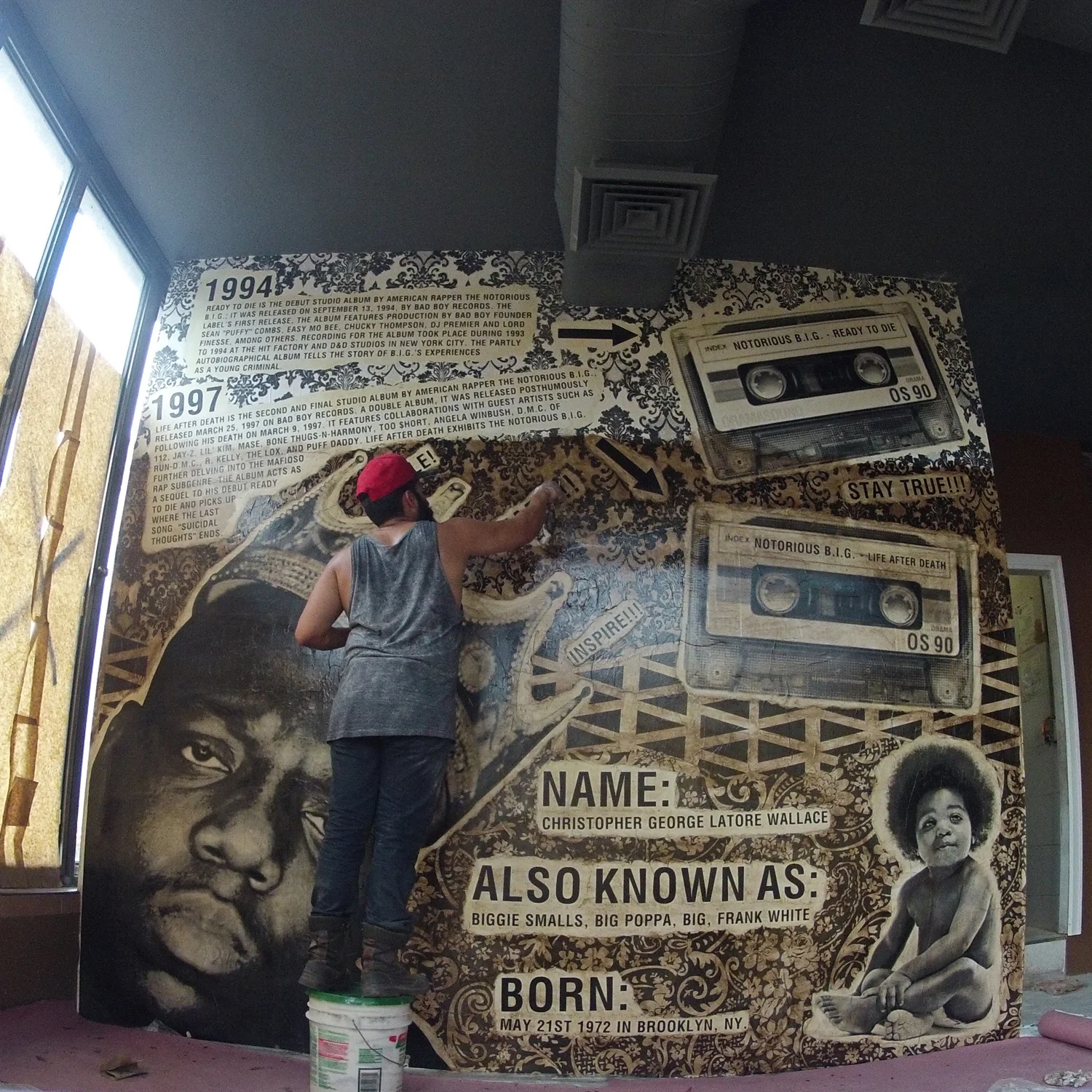 Ivan Orama working on one of his walls at Hello Bklyn .