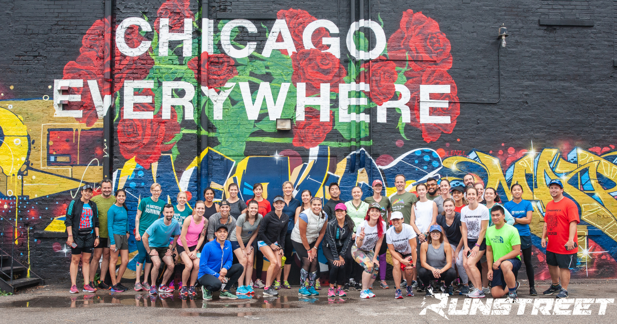 Chicago Marathon spectators - runners in front of mural wall in Chicago