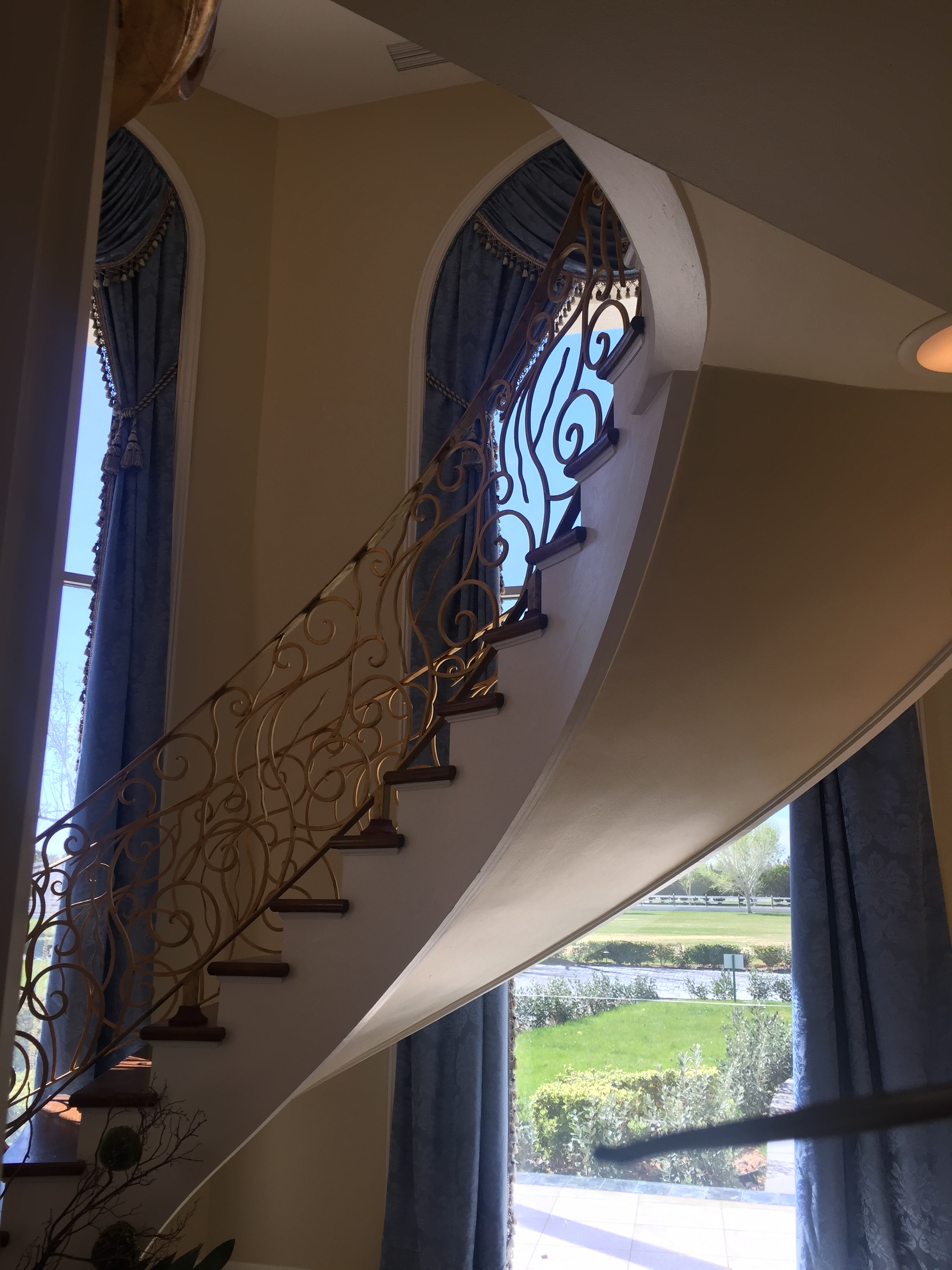1 of 2 grand staircases in the foyer. But only 3 bedrooms upstairs. Keepin' it real yo!