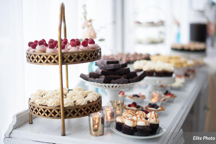 This Sweets Table has a nice variety of desserts and included Mini Cupcakes, Tiny Cheesecake tarts topped with fresh fruit, Brownies, and Lemon Bars.
