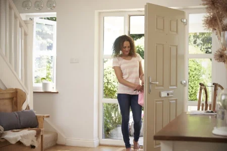 Woman entering her new front door in Spokane, WA