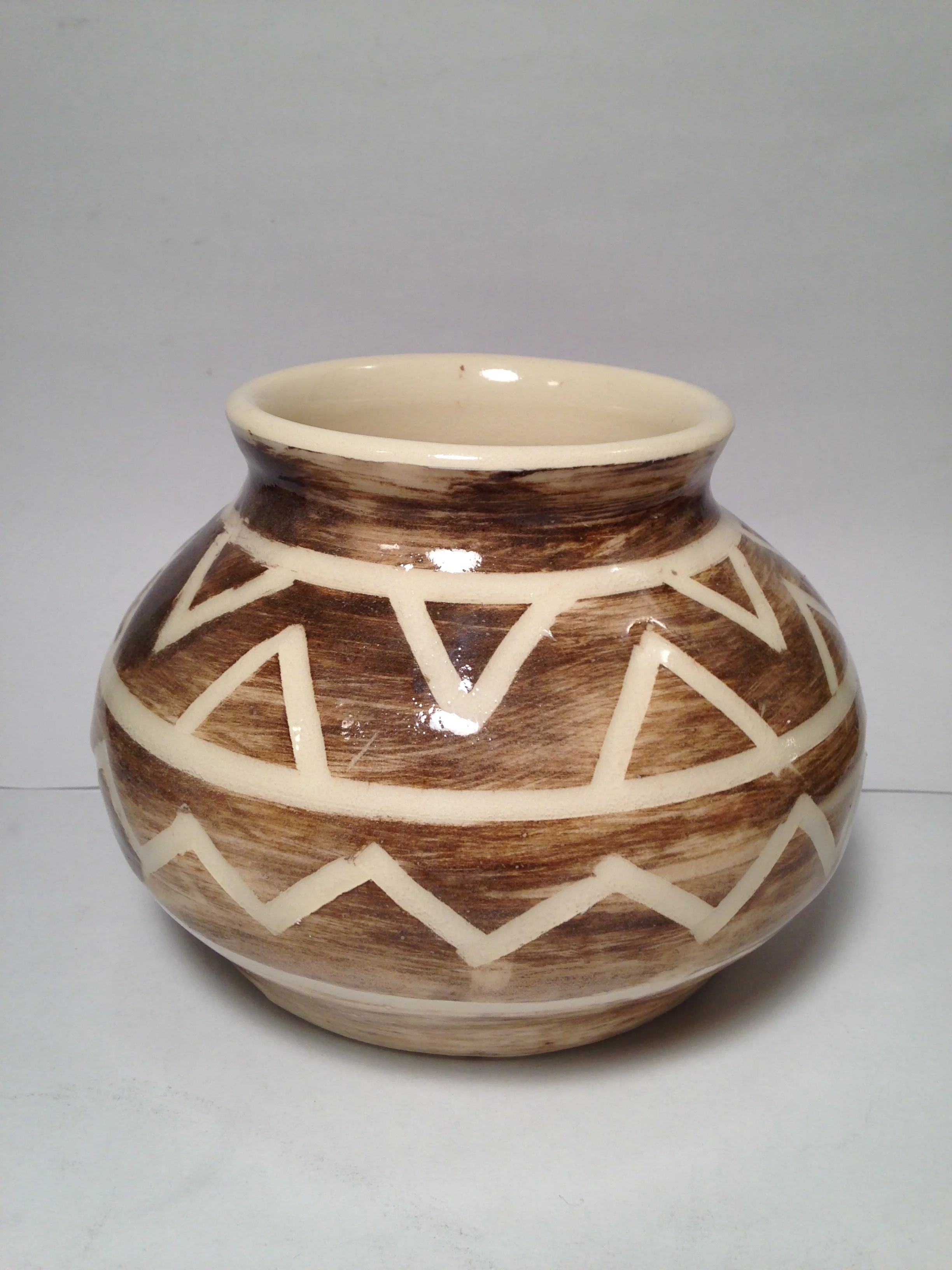 Pot with geometric zig-zag pattern