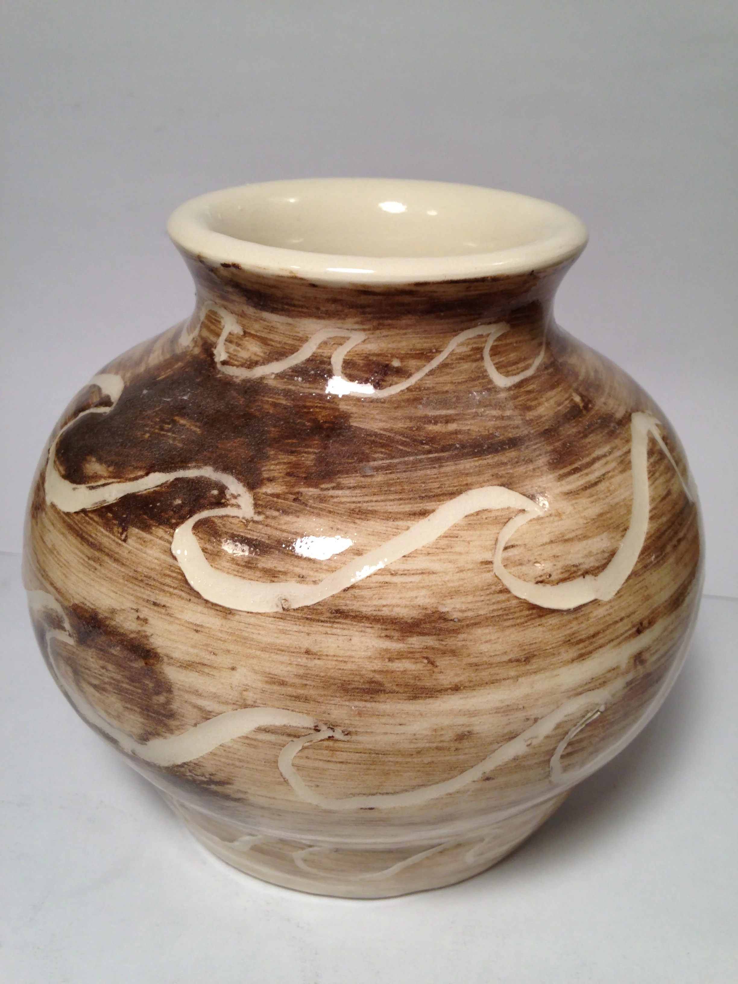 Pot with stylized wave pattern