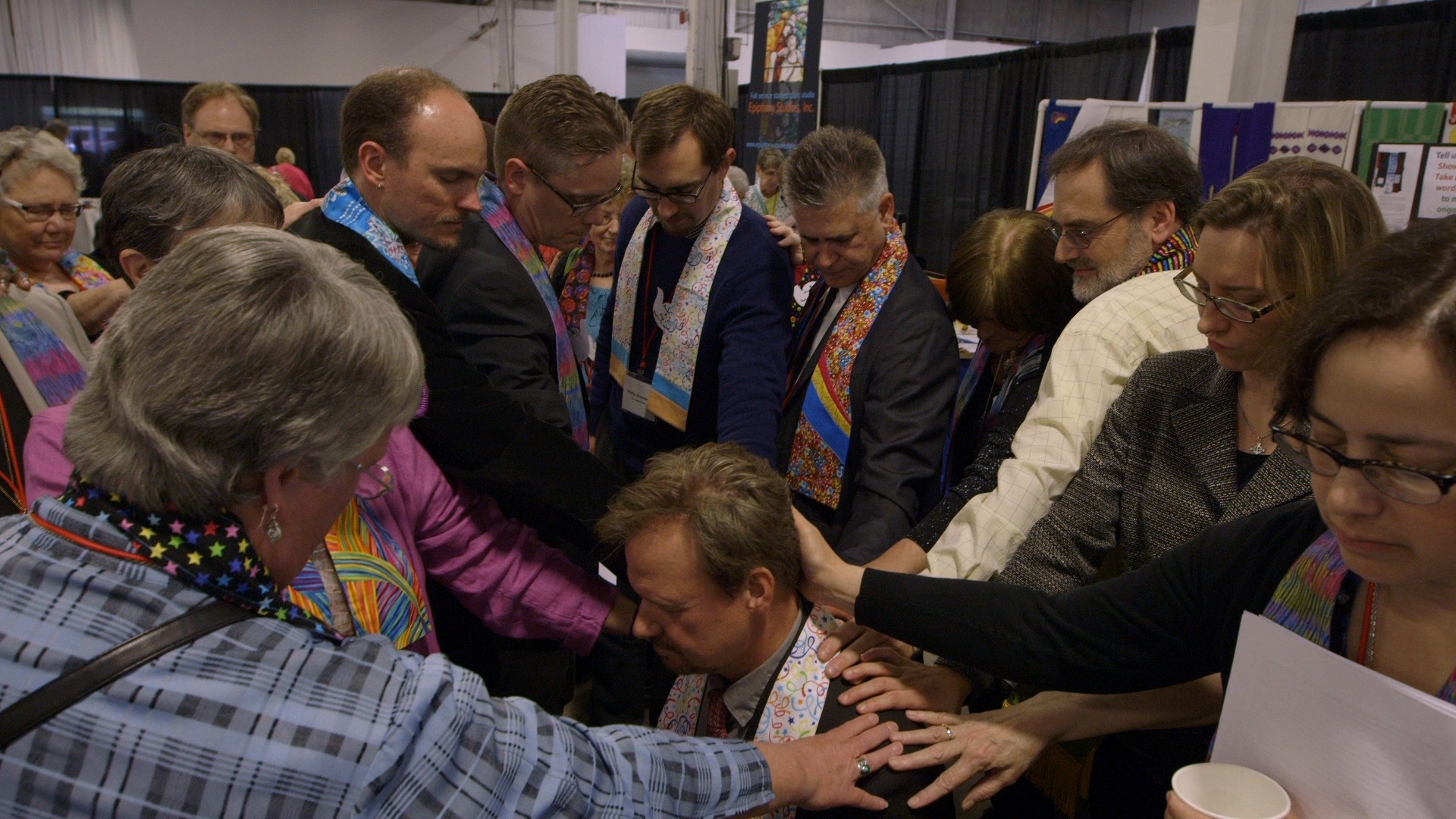 Former colleagues lay hands on Rev. Frank Schaefer at the Eastern Pennsylvania Annual Conference in 2014.