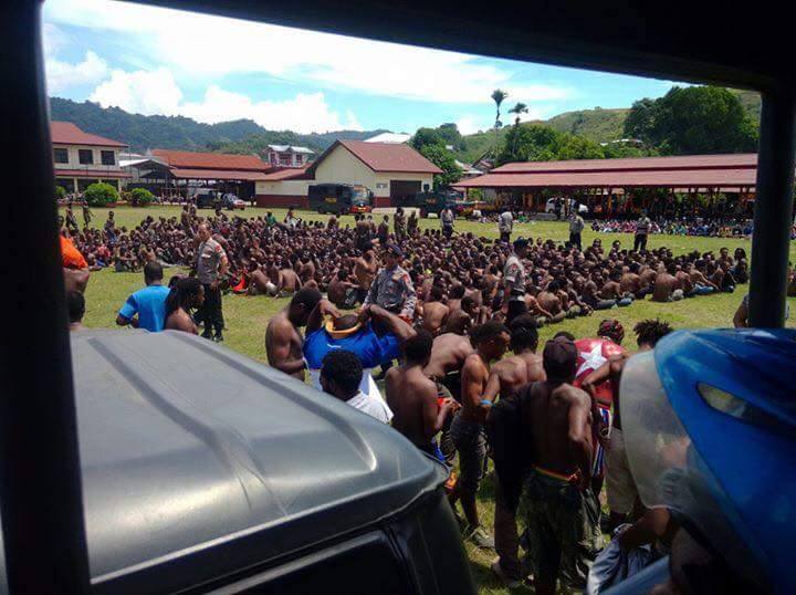 From Jason Mcleod: Last Monday (2 May) the Indonesian police arrested nearly 2000 people. As the jail cells filled up there was no where to hold those arrested. This picture shows the police detaining people on the sports oval of the mobile police brigade's grounds in Kotaraja, Jayapura (Port Numbay). You can see that the police have stripped the activists down to their pants. They kept them there all day in 35 degree heat without water.