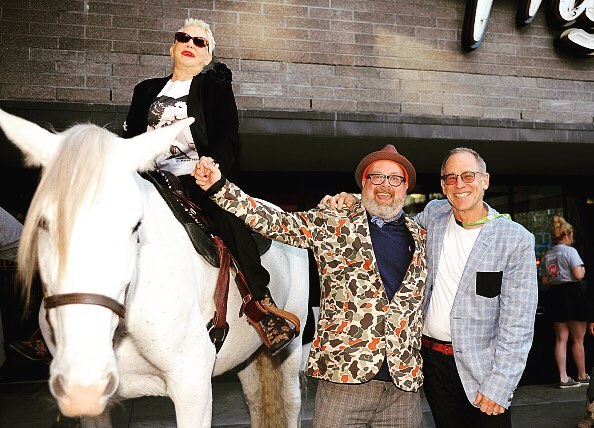 Rose Hartman on top of a white steed at the film's premiere at SXSW 2016. She is holding hands with Director Øtis Mass. Photo: The Artists Company.