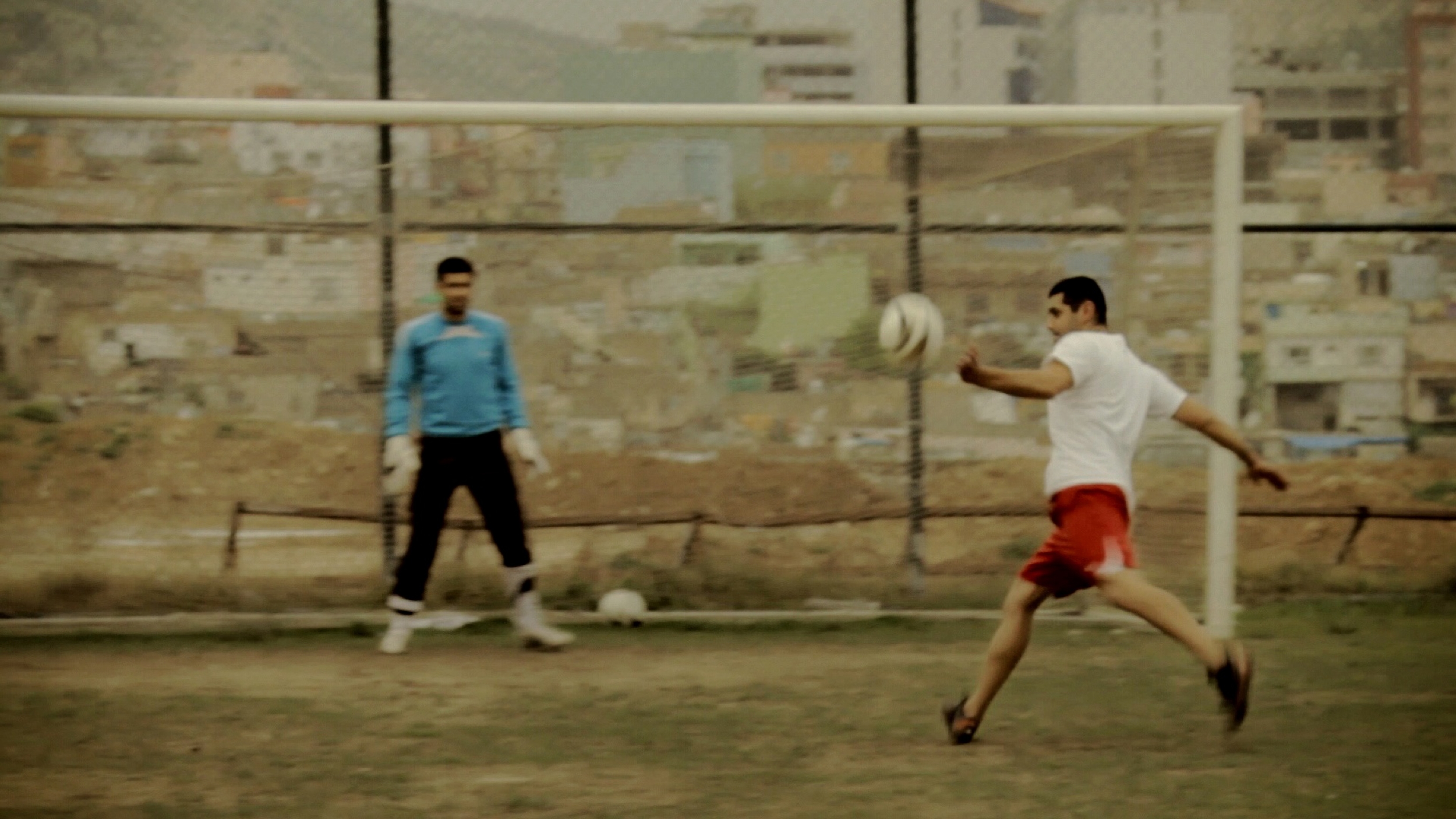 During his tryout for a professional soccer team in Kurdistan Iraq, where his parents were born, Mikael connects on a volley as he hopes to impress onlooking coaches.