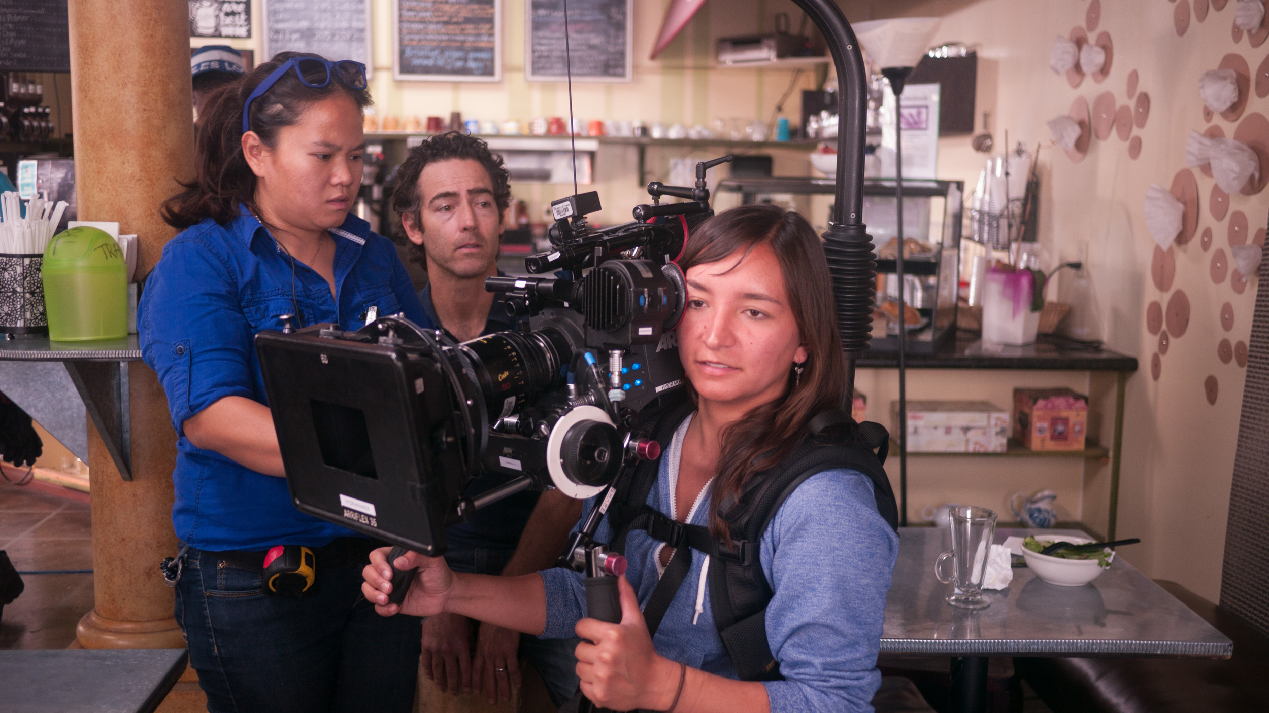 RATED - Behind The Scenes with Assistant Camera Michaela Angelique, Director John Fortson and Director of Photography Olivia Kuan. Photo credit: Bruno Valenti