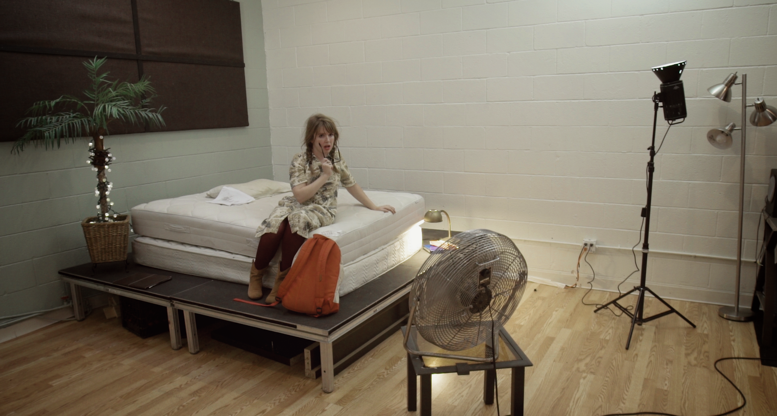 Janice (Natalie Palamides) hams it up for the camera. 