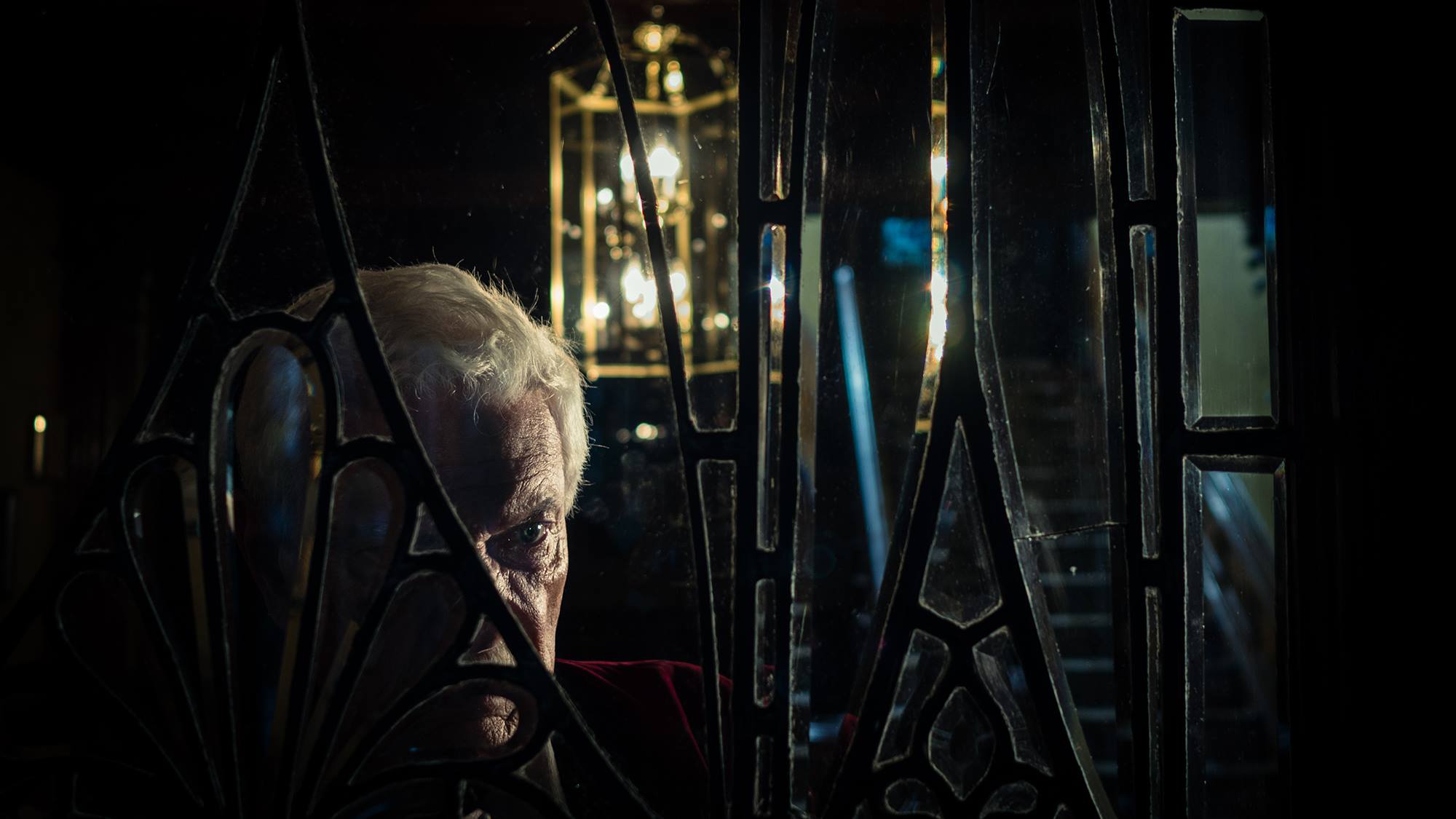 Break My Bones: Mr. Cleveland through the window of his house.