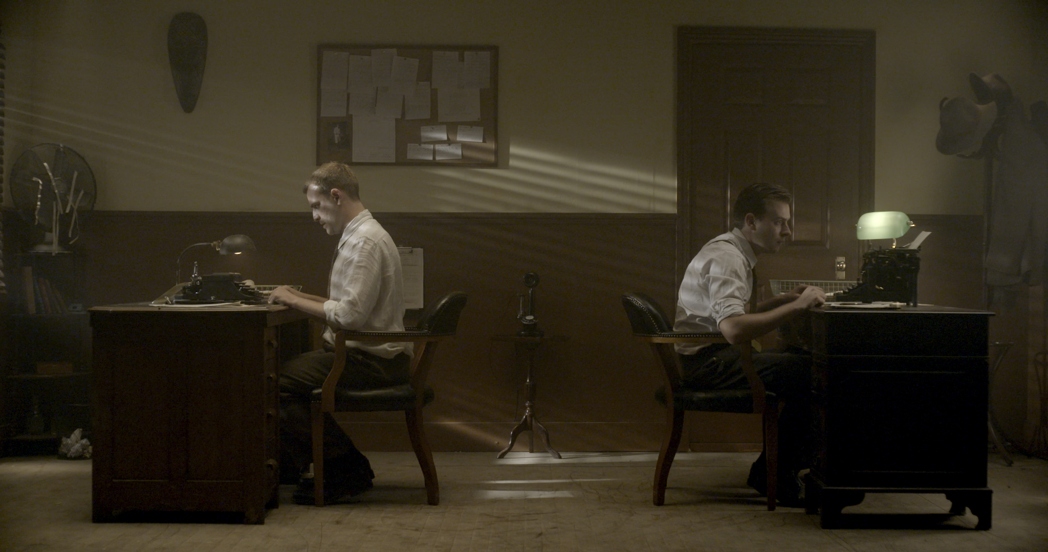 Over My Dead Body - Spencer and Marx at their desks.