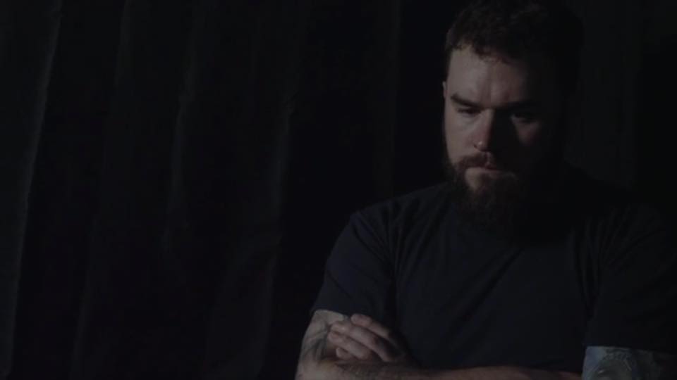 Director Adam J. Reeb looking over the field of dominos lost in thought.