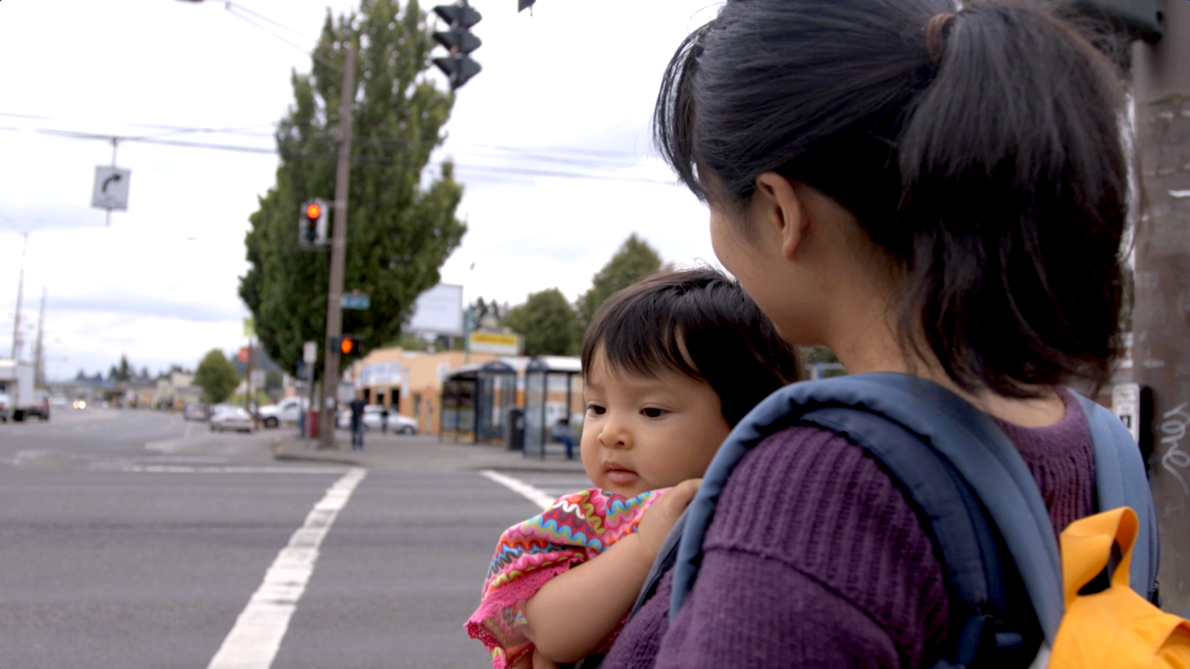 Khanh at corner: Khanh Pham and her daughter at SE 82nd and Division.