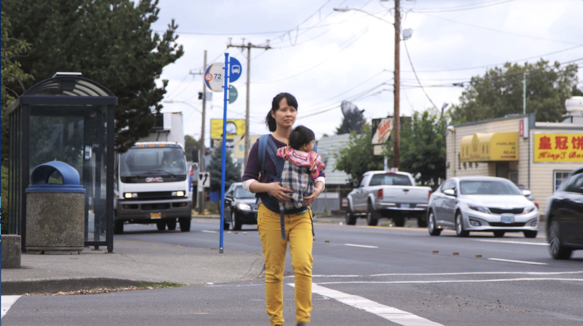 Khanh crosses street: Khanh Pham and her daughter at SE 82nd and Division, an intersection that scares her.