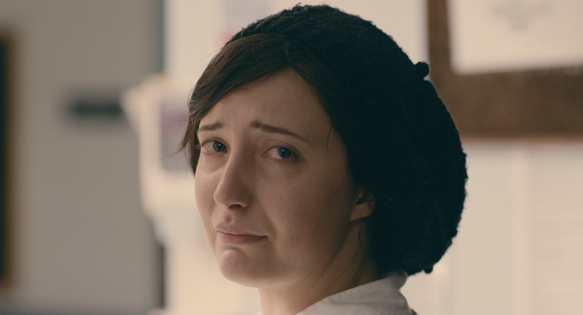 Adherence - Maddy makes eye contact with Charlie near the conclusion of the film, while she waits for her medication.