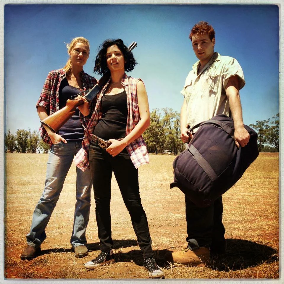 All About E - Two Girls, a boy and a bag of money.