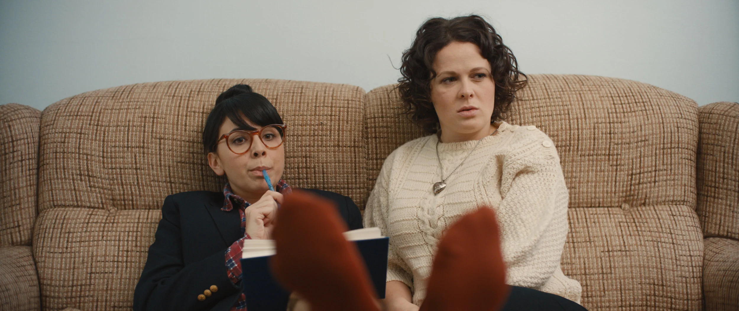 Dim the Fluorescents - Audrey (Claire Armstrong) and Lillian (Naomi Skwarna) brainstorm influential entertainment industry figures to invite to their big hotel conference performance.
