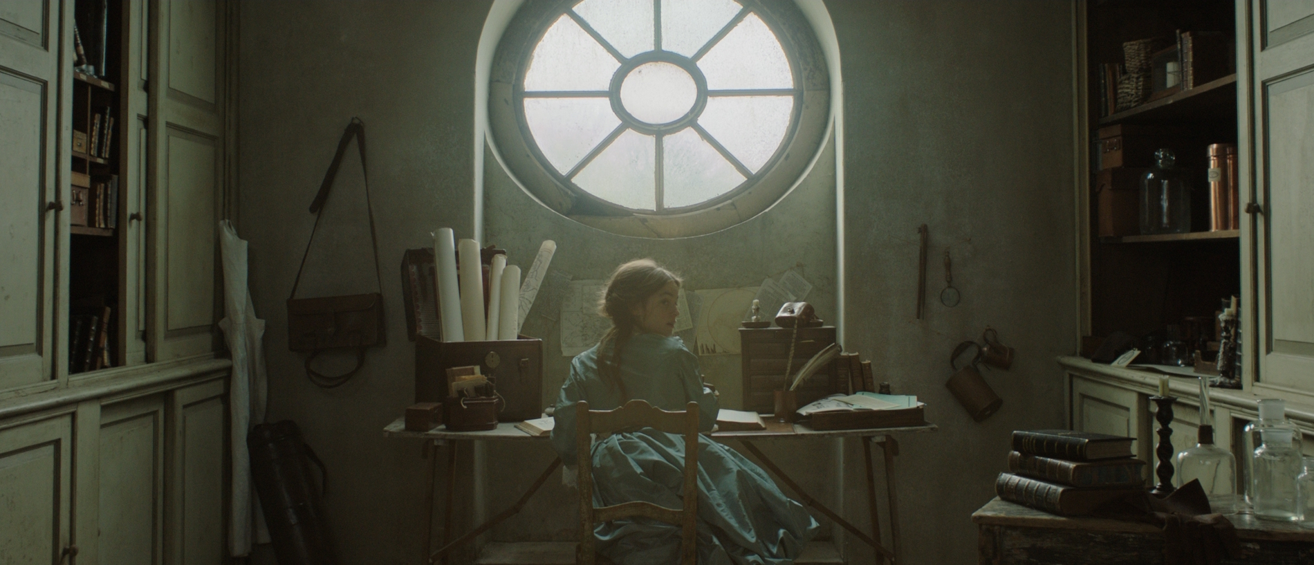 THE RAIN COLLECTOR- Vanessa (Celine Buckens) works in her attic - image by Neus Ollé