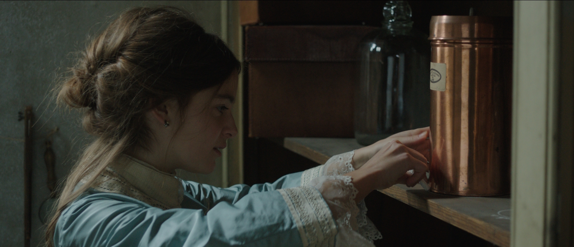 THE RAIN COLLECTOR- Vanessa (Celine Buckens) places a rain gauge in her attic - image by Neus Ollé