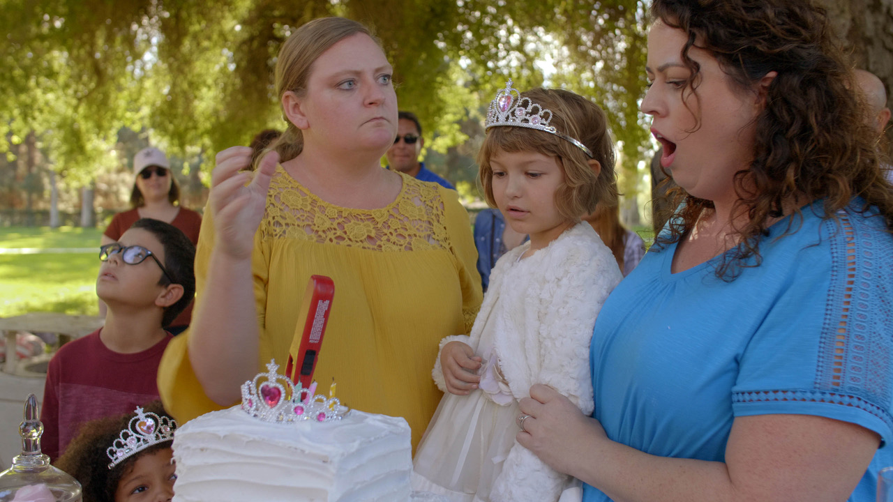 The “cake incident” scene, showing our two leads Tiffani Ann Mills as Darla (mom of an autistic child) and Bunny (Kaylie Gipson), reacting to the lighter plunged into Eleanor’s (Ellie Carlin’s) birthday cake.