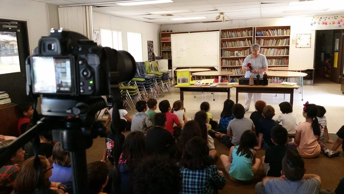 Selma presenting at a school