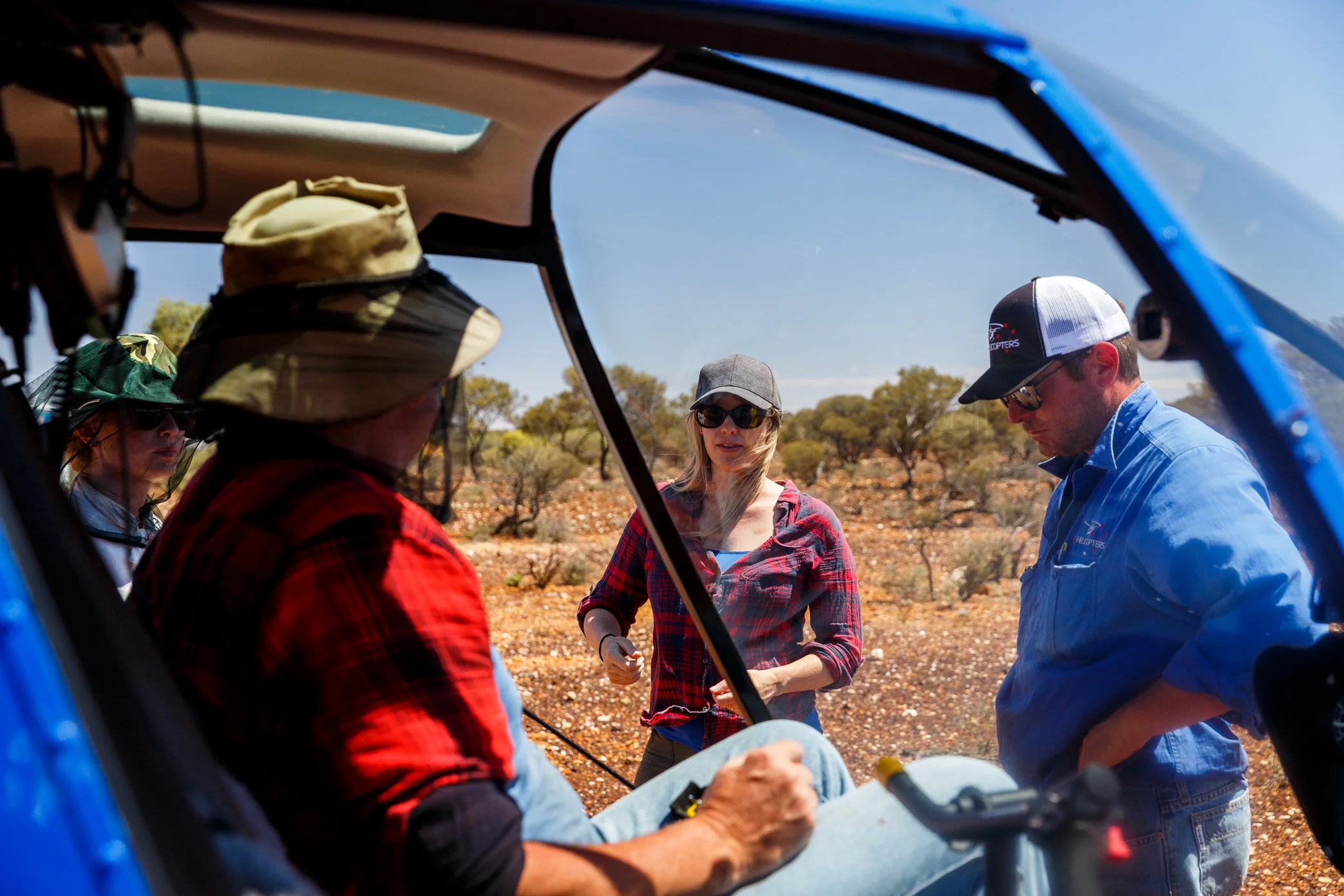 Writer/Director Alison James (Centre) speaks with Producer Brooke Silcox (L), Armourer Dave Norton-Woad and Helicopter Pilot Clint Archer (R) Photo by Jessica Wyld © No Thing Productions